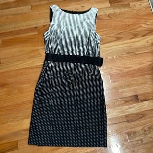 Black and white poka dot dress w a black cummerbund belt. Size 10.